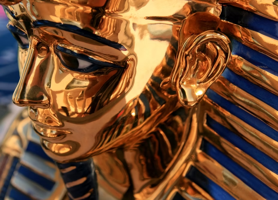 Golden pharaoh mask photographed in close detail